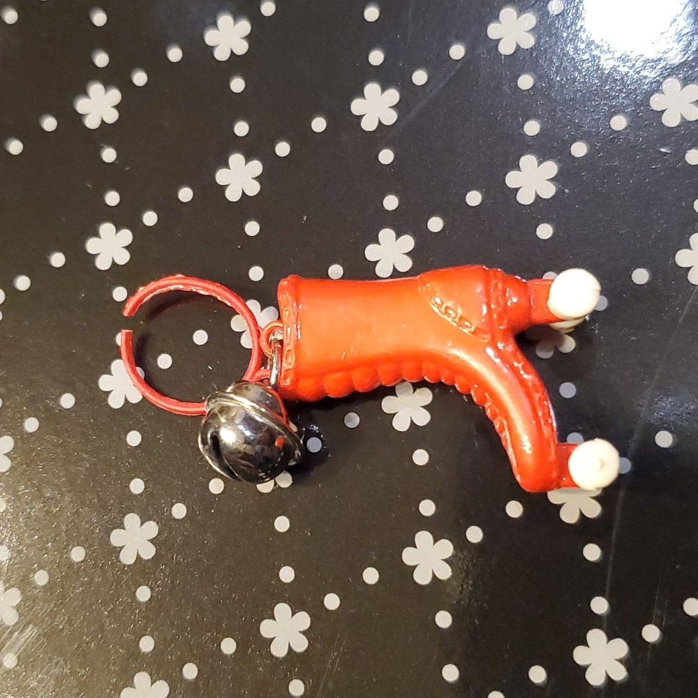80s plastic rollerskate charm with bell